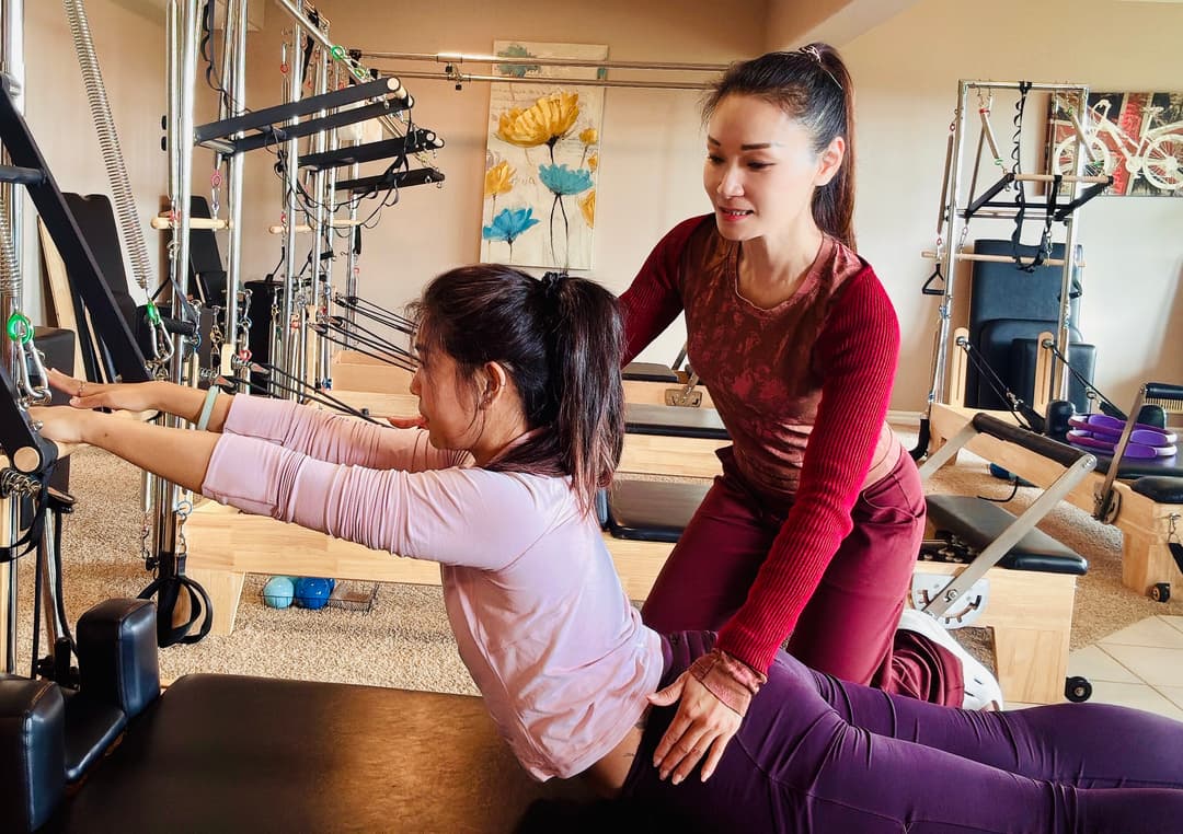 Shelly demonstrating Pilates form and alignment